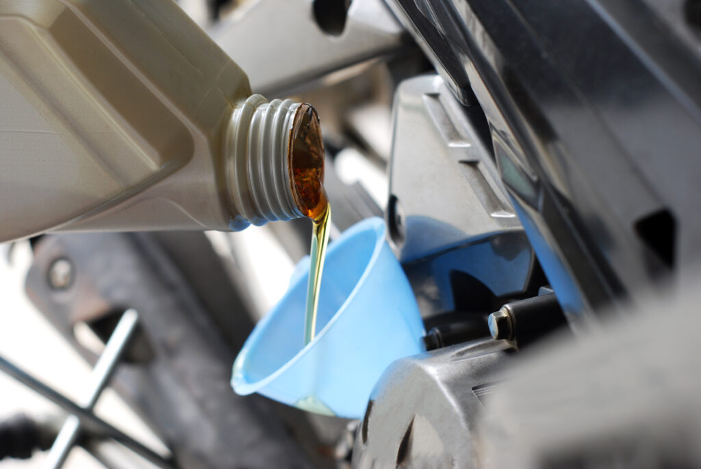 Close Up Bottle Pouring Motor Oil Engine Close Up Bottle Pouring Motor Oil Engine