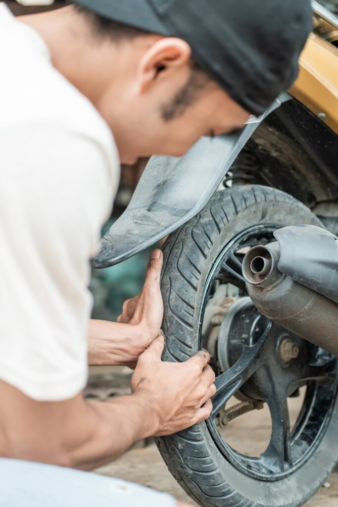 Close Up Tire Repairman Holding Pressing Tires Check While Tire Repair Shop 8595 24957 Close Up Tire Repairman Holding Pressing Tires Check While Tire Repair Shop 8595 24957
