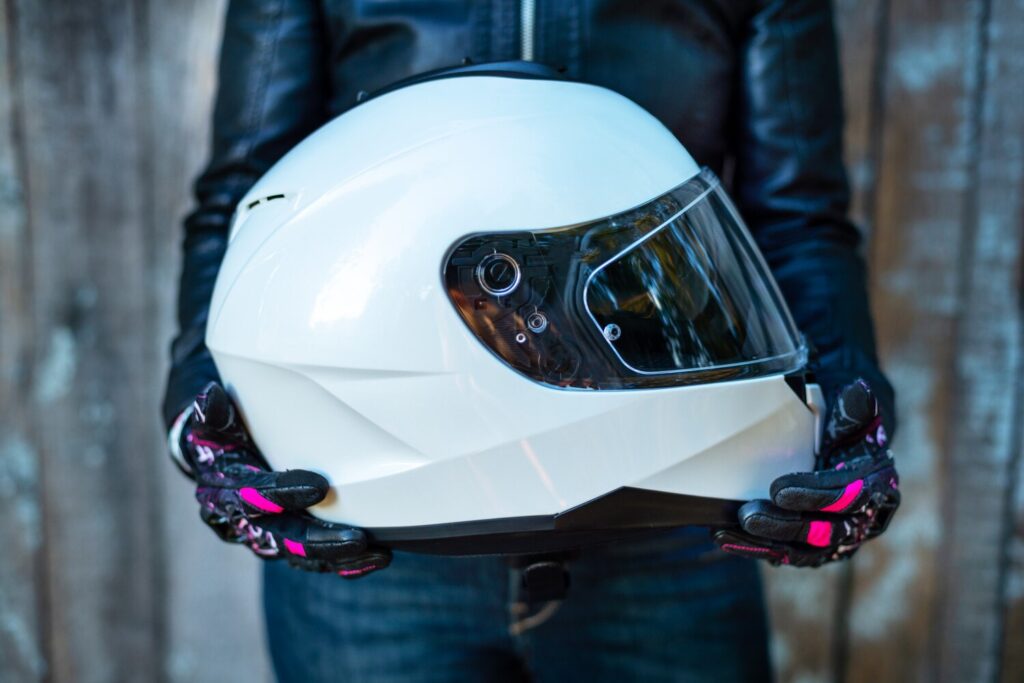 Woman Leather Jacket Holds Motorcycle Helmet 181654 1166 Woman Leather Jacket Holds Motorcycle Helmet 181654 1166