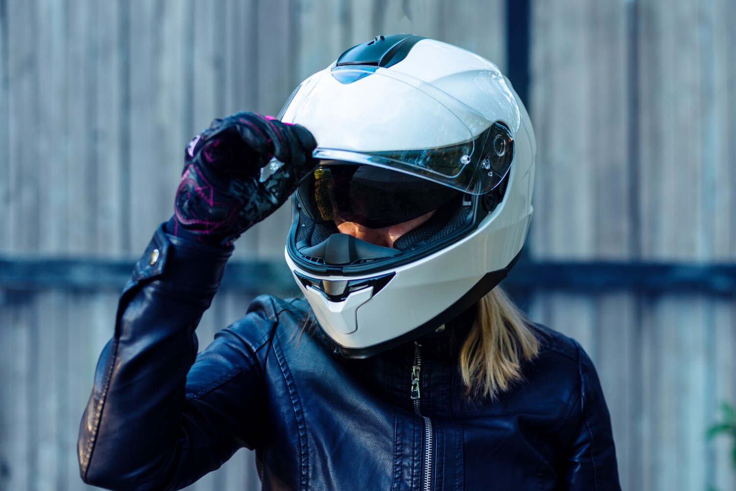 Woman Puts Motorcycle Helmet Fastens Clasp 181654 1163 Woman Puts Motorcycle Helmet Fastens Clasp 181654 1163