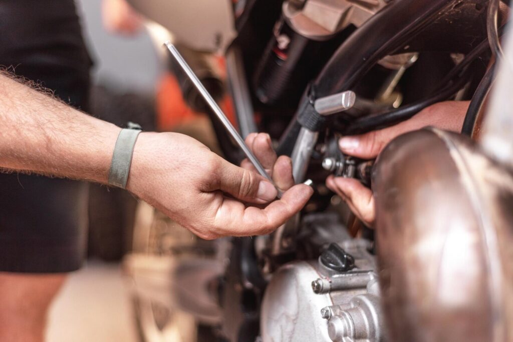 Close Up Mechanic Repairing Motorcycle Garage 56854 5435 Close Up Mechanic Repairing Motorcycle Garage 56854 5435