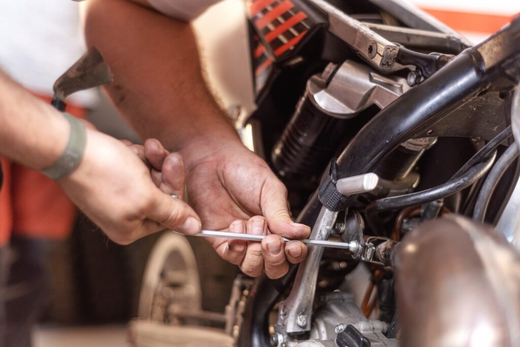 Mechanic Repairing Motorbike Engine Workshop 56854 2533 Mechanic Repairing Motorbike Engine Workshop 56854 2533